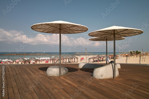 Tel Aviv beach promenade, deck with sunshade photo