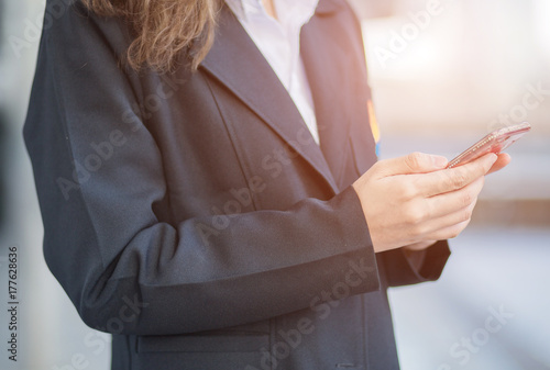 Business woman calling to connect with customer for discuss her business in city.