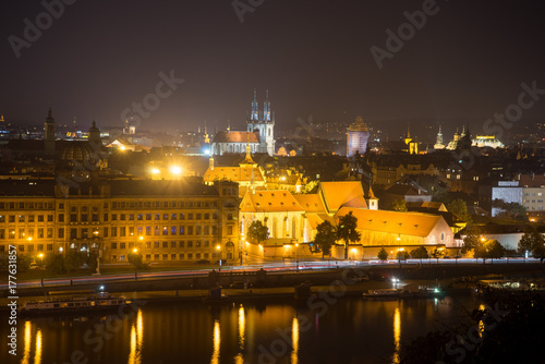The center of Prague at night. Embankment of Vltava. The Church of the Virgin Mary in front of Tyn