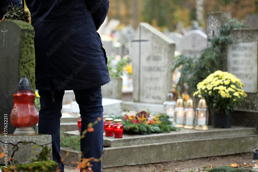 People at the Polish traditional cemetery on the feast of all saints day at 1st November People at the Polish traditional cemetery on the feast of all saints day at 1st November