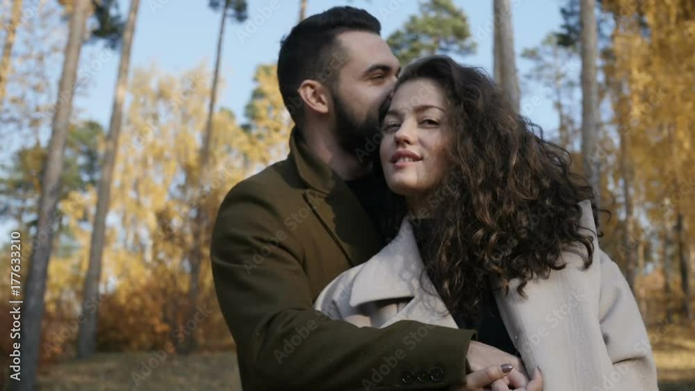 Beautiful couple hugging in park Beautiful couple hugging in park