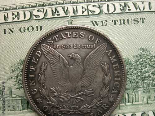 In God we trust on banknote and Morgan dollar coin