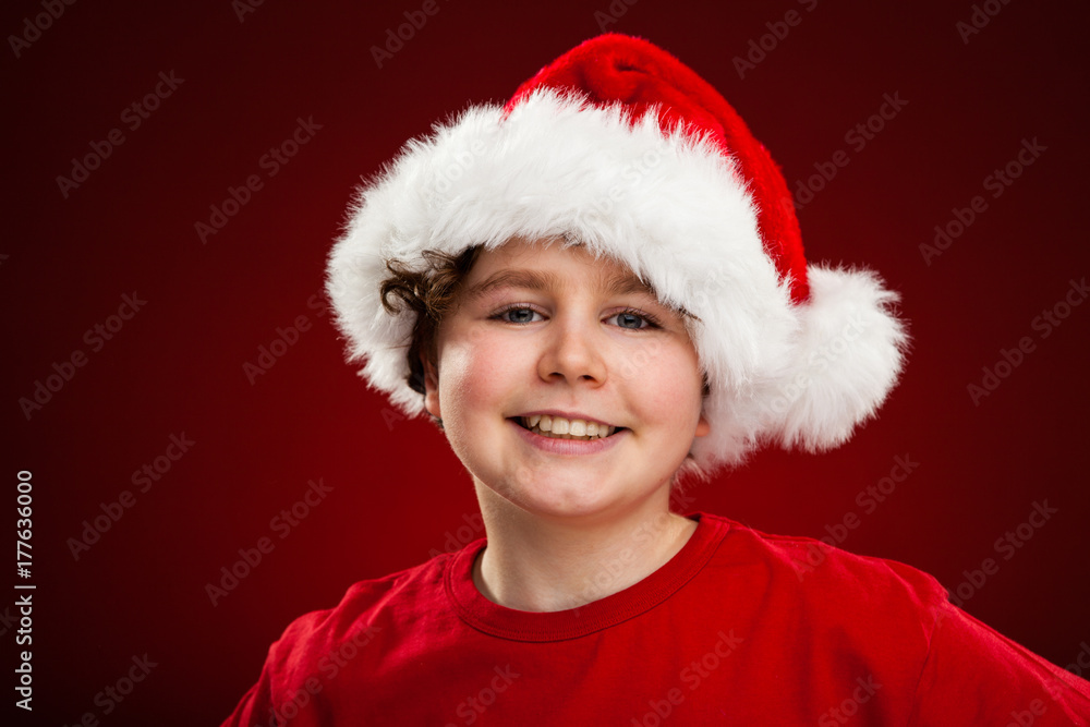 Christmas time - boy with Santa Claus Hat Christmas time - boy with Santa Claus Hat