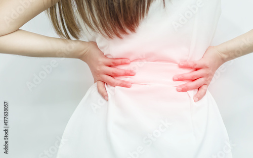 Wallpaper Mural A woman in white dress feeling pain on his back. Office syndrome. Back pain from work. Herniated nucleus pulposus. spine pain. spinal degeneration. Torontodigital.ca