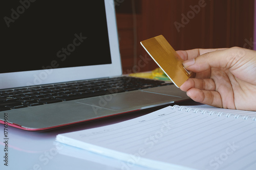 Hand holding a credit card ...