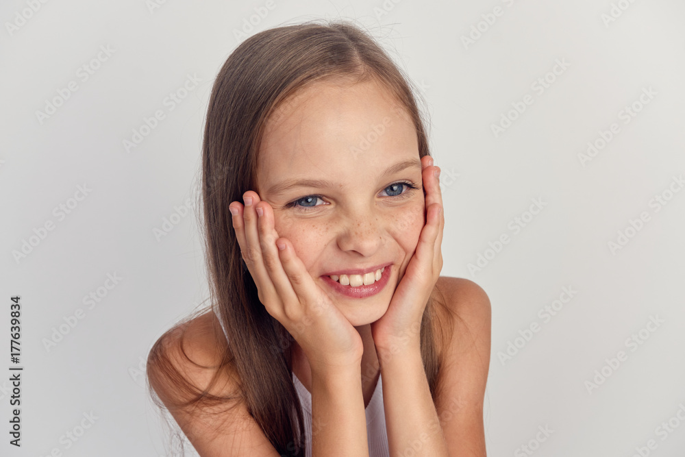joyful girl smiling on a light background portrait joyful girl smiling on a light background portrait