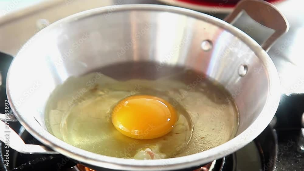 Chef Making Pan-Fried Egg with Chinese Sausage and Pork Topping Chef Making Pan-Fried Egg with Chinese Sausage and Pork Topping