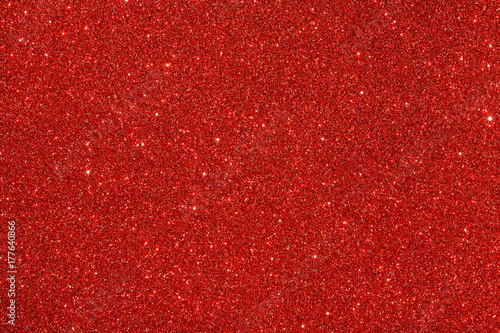 Red (ruby) glitter background. Sparkle texture. Abstract background for New Years or Christmas holiday photo