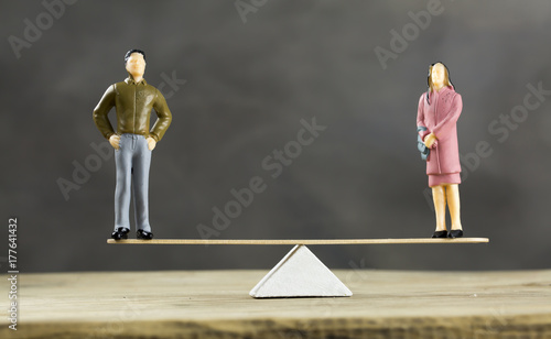 Balanced Scale With a Man and Woman photo