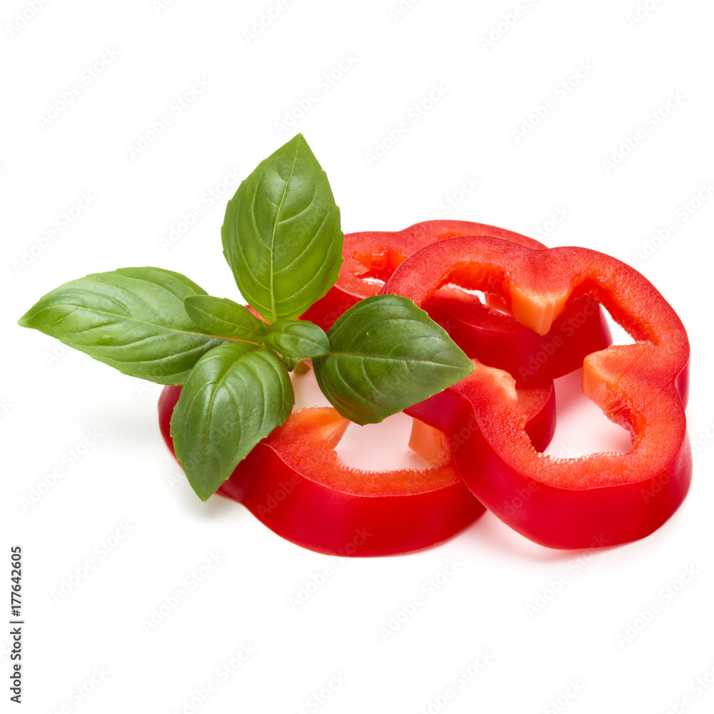 Red sweet bell pepper slices and basil leaves isolated on white background cutout Red sweet bell pepper slices and basil leaves isolated on white background cutout