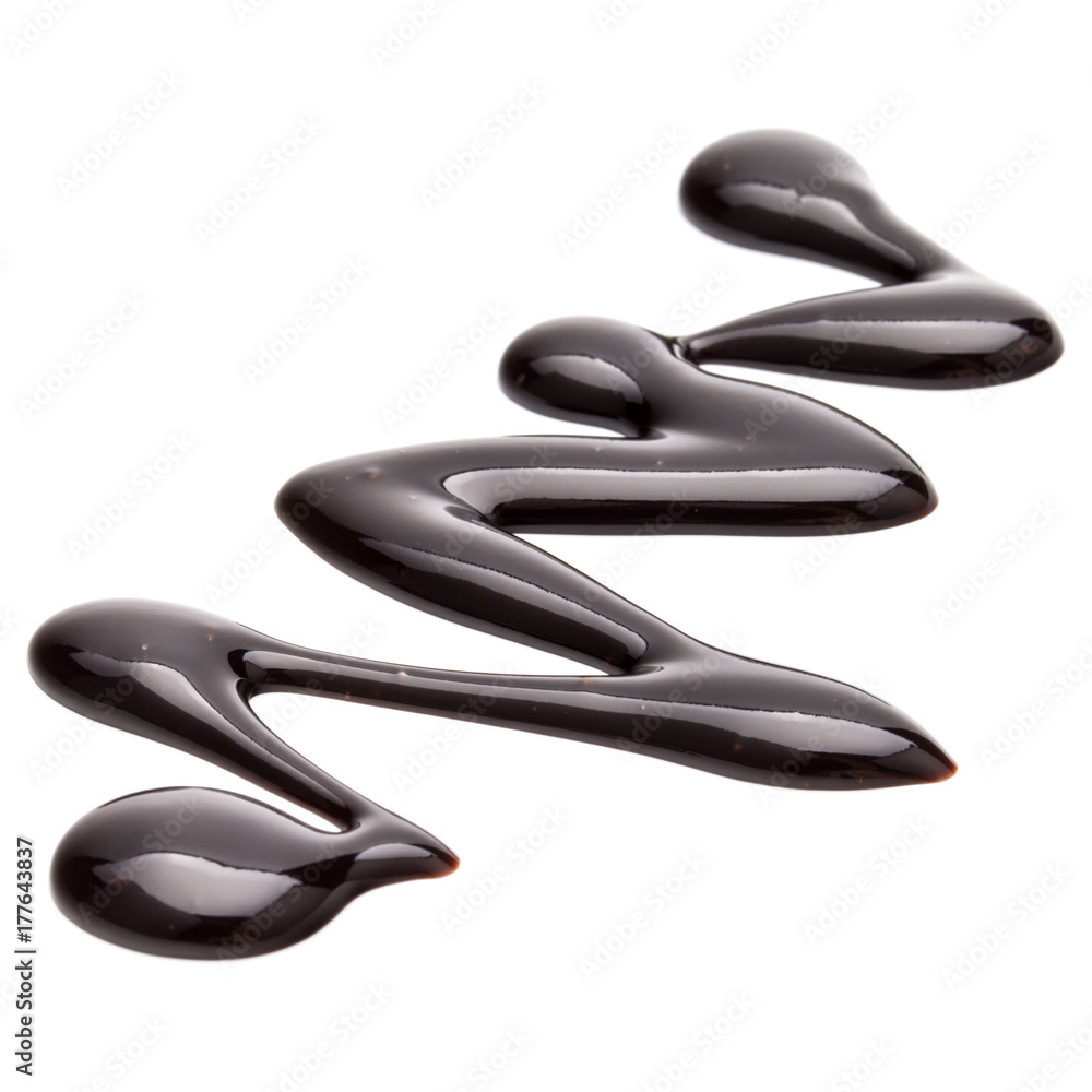 Chocolate syrup drop isolated on white background Chocolate syrup drop isolated on white background
