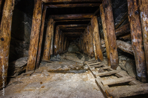 Old abandoned underground ore mica  mine shaft tunnel photo
