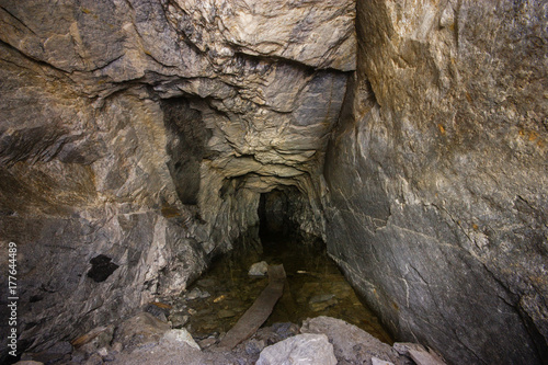 Old abandoned underground ore mica  mine shaft tunnel