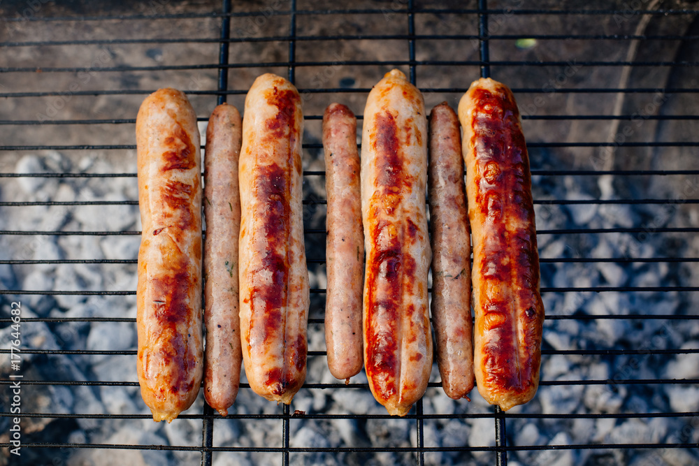 Oktoberfest. Homemade chicken sausages and lamb sausages are roasted on the grill. Oktoberfest. Homemade chicken sausages and lamb sausages are roasted on the grill.