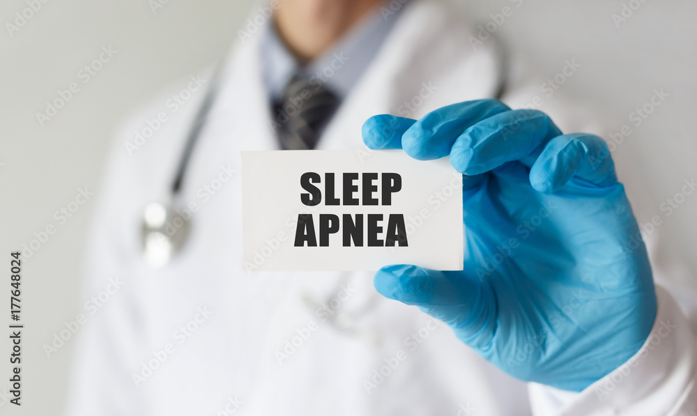 Doctor holding a card with text Sleep Apnea, medical concept Doctor holding a card with text Sleep Apnea, medical concept