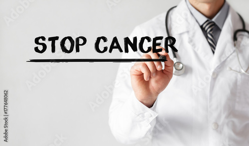 Doctor writing word STOP CANCER with marker, Medical concept