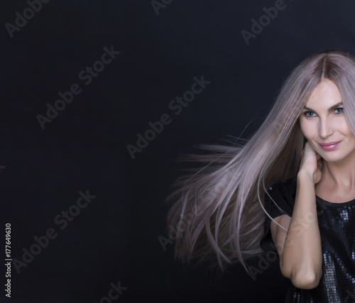 Beautiful model with smooth flying hair. Portrait shot.