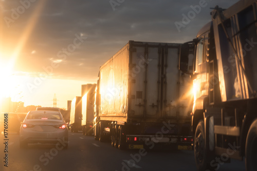 summer sunset on the highway cars and big trucks