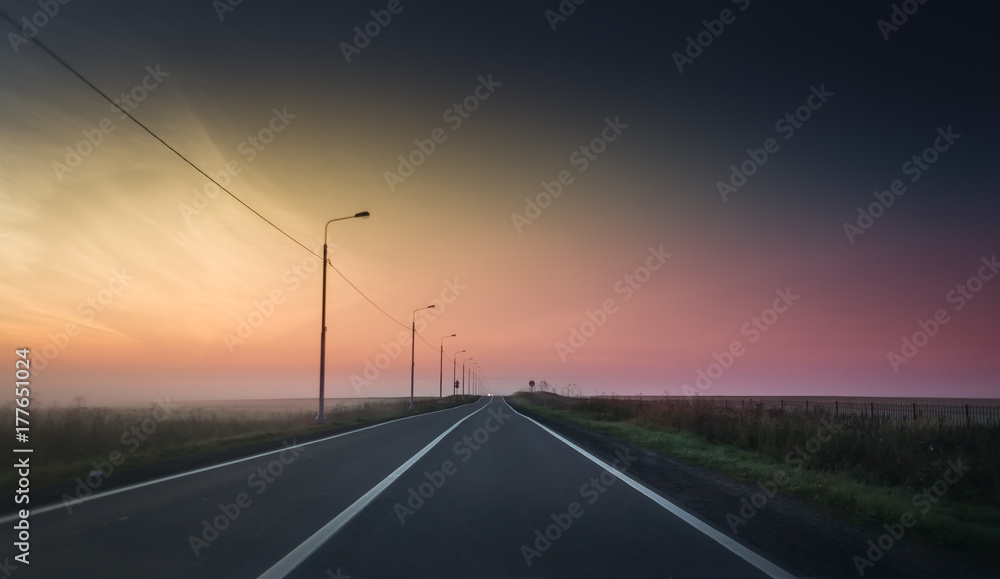 Bright sunrise over countryside empty road Bright sunrise over countryside empty road