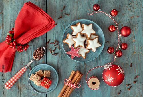 Christmas background in red and white on rustic turquoise wood photo