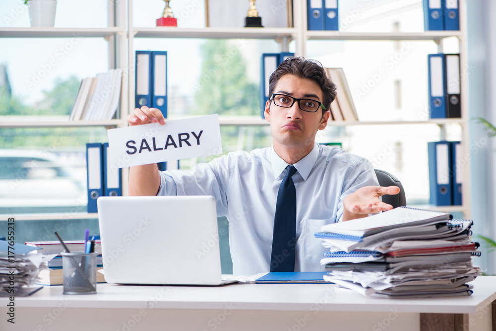 Young businessman asking for salary increase in office Young businessman asking for salary increase in office