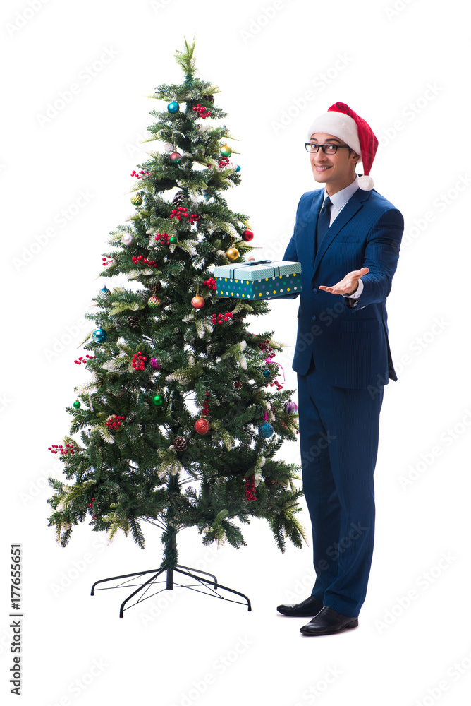 Businessman decorating christmas tree isolated on white Businessman decorating christmas tree isolated on white