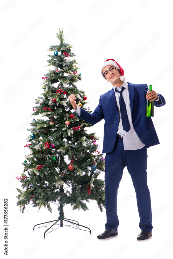 Businessman decorating christmas tree isolated on white Businessman decorating christmas tree isolated on white