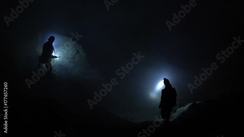 Sulfur miners at Ijen volcano in the night. Kawah Ijen volcano in East Java, Indonesia. photo