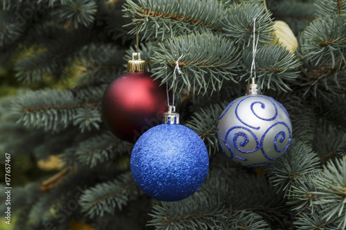 Red, Silver and Red Crystal balls on a Christmas tree.