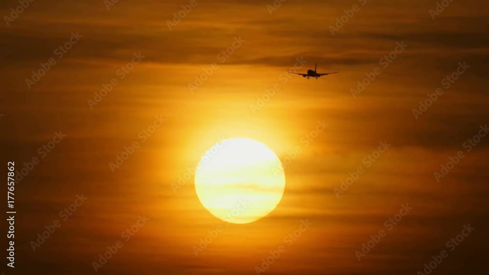 Silhouette of passenger airplane landing. Sunset background Silhouette of passenger airplane landing. Sunset background