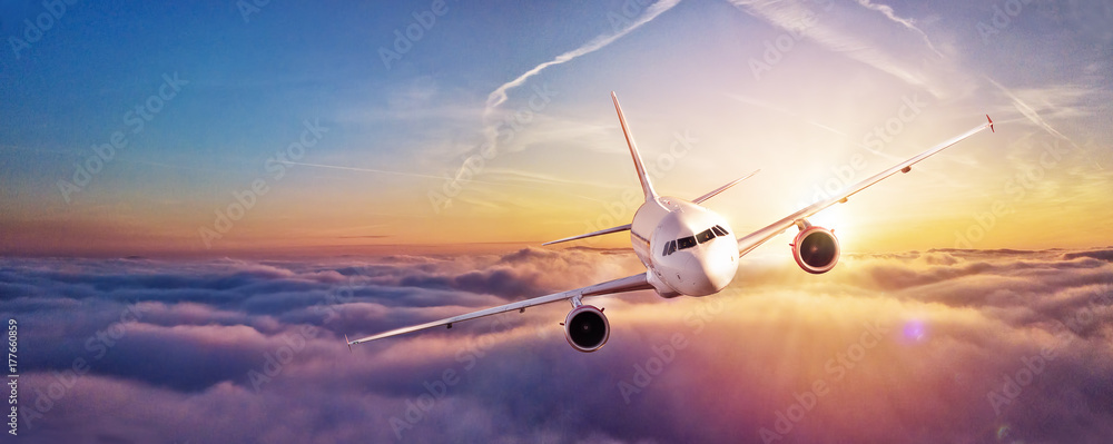 Fototapeta Komercyjny samolot latający nad chmurami