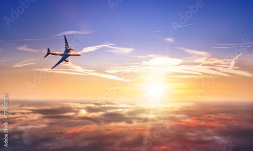 Commercial airplane flying above clouds