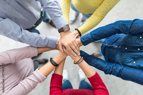 Naklejka Stack of hands. Unity and teamwork concept.