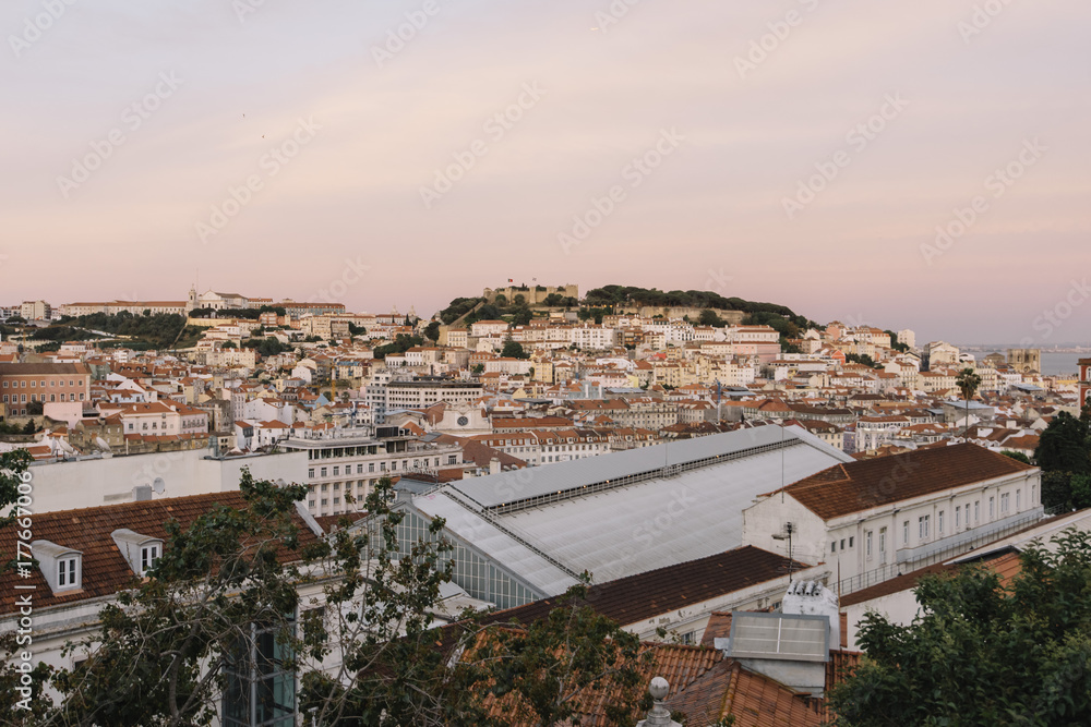 Beautiful view on a pink sunset Lisbon from a viewpoint 