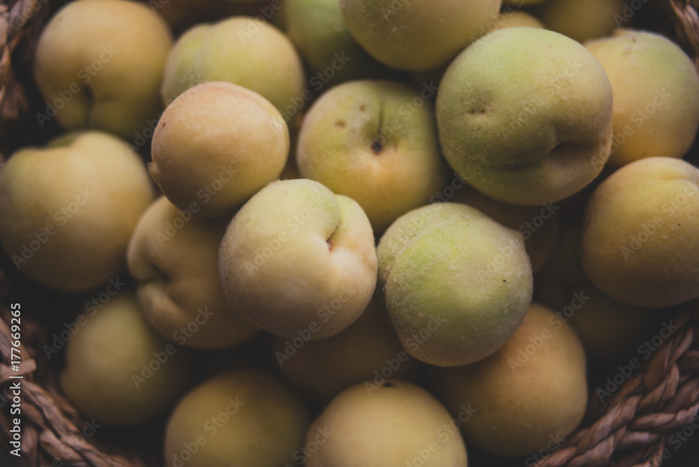 Pile of vineyard peach in wooden basket