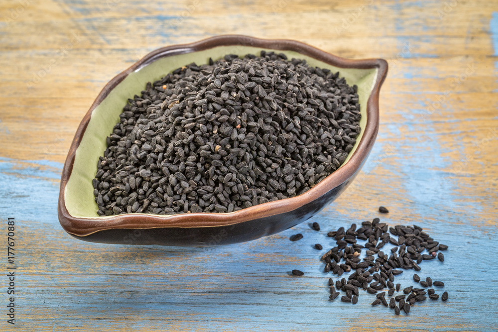 black cumin seeds in a leaf bowl black cumin seeds in a leaf bowl