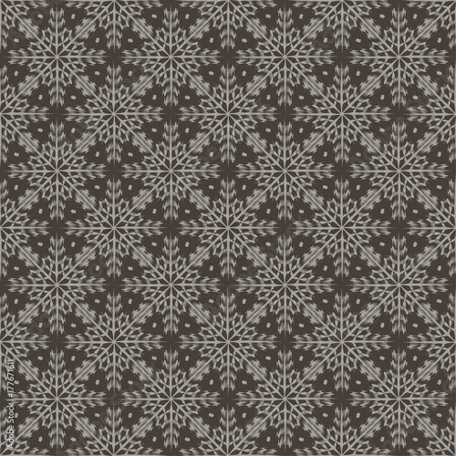 White snowflakes on a gray background. Beautiful abstract background. Seamless pattern.