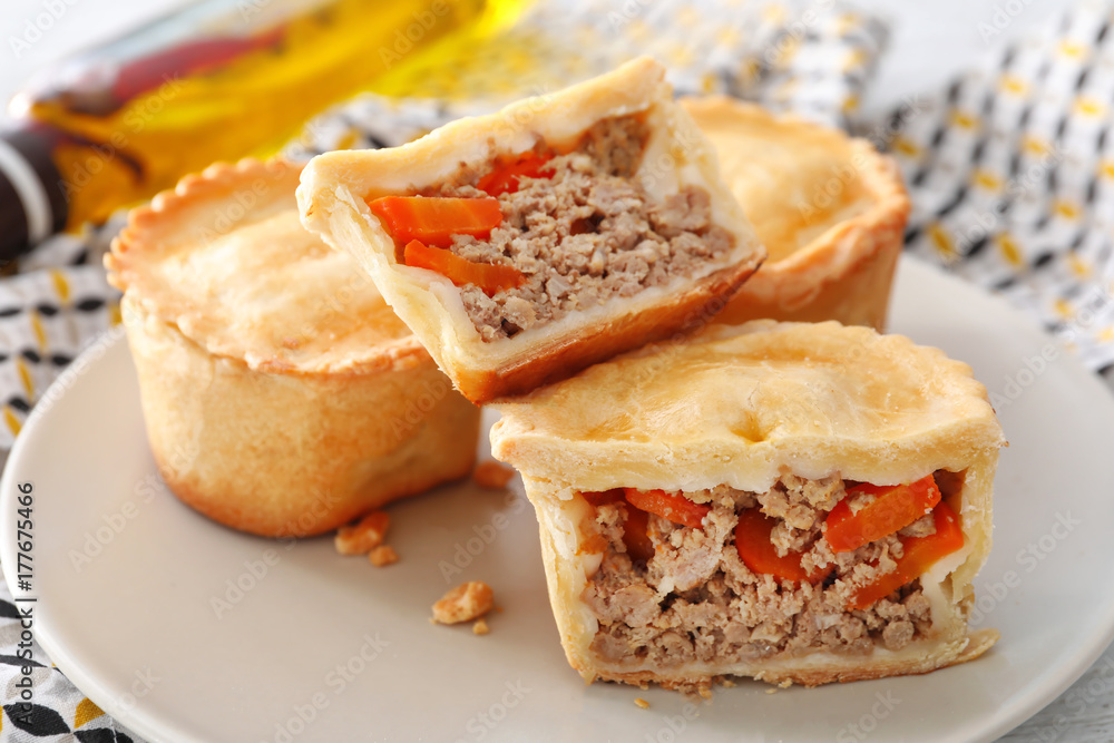 Delicious little meat pies on plate Delicious little meat pies on plate