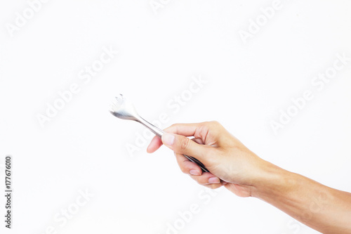 A man hand holding kitchen tongs on white background. Hand holding metal serving kitchen tongs like a picking food or barbecue. Tongs for pick food  ice  barbecue  vegetable Instead of using the hand.