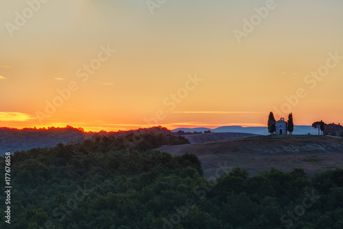 Tuscany landscape at sunrise with a little chapel of Madonna di Vitaleta  Italy