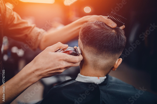 Barber shop. Barbershop Hairdresser makes hairstyle man