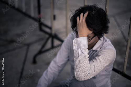 business man is stressed from his work. depression and anxiety concept. © SP56