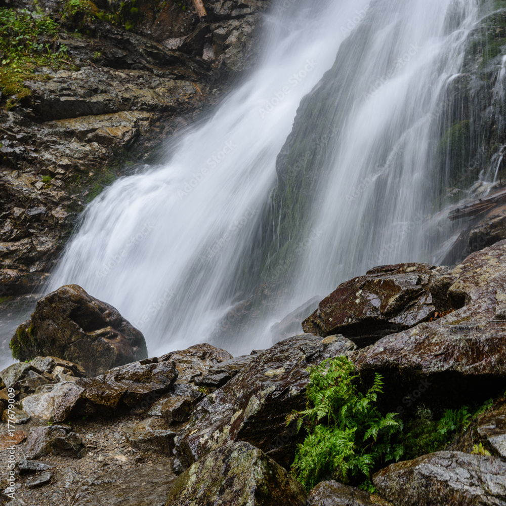 Fototapeta premium large Waterfall from ravine in autumn, long exposure