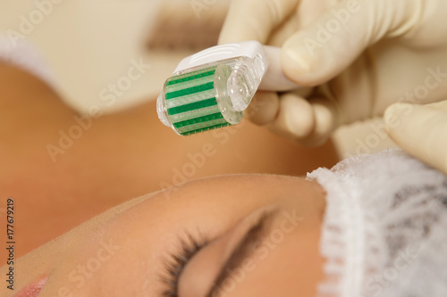 Woman in beauty salon during mesotherapy procedure. photo