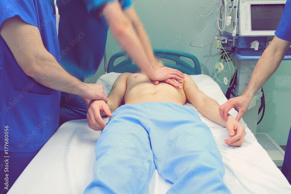 Team of doctors saving patient's life Team of doctors saving patient's life