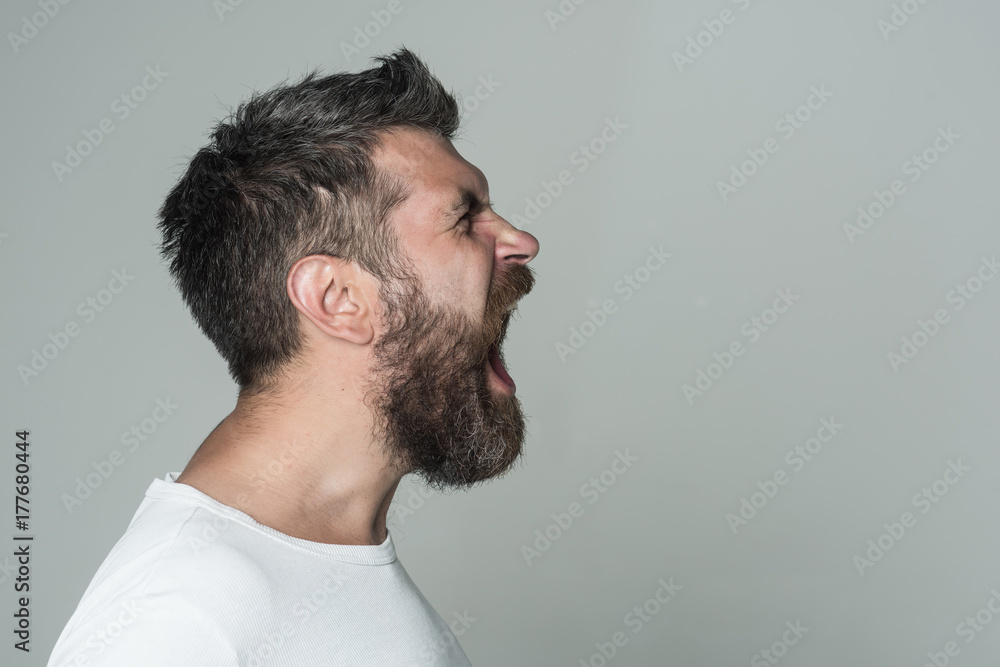 man with long beard on angry face man with long beard on angry face