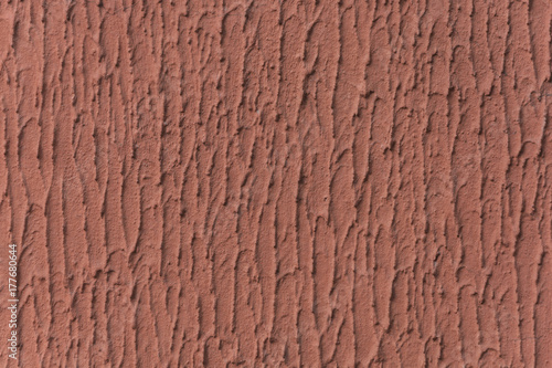 The texture of the putty with the red paint