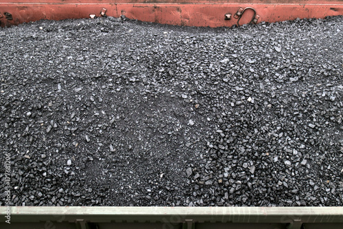 Charcoal carriage
Horizontally.Vid from above. Black coal immersed in freight cars, located on the tracks. photo