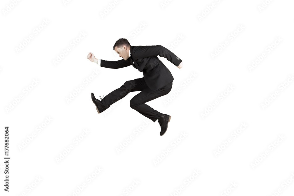 American businessman jumping in the studio