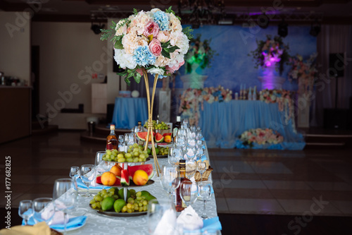 Beautiful decorated wedding restaurant for marriage. Colorful decoration for celebration. Beauty bridal interior. Concept of style of banquet hall